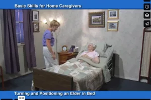 A caregiver turning and positioning of old women on a bed