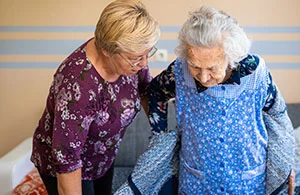 Dementia caregiver elderly woman